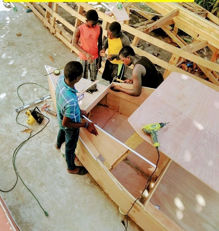 How we began in 2018 building a little boat with local kids.